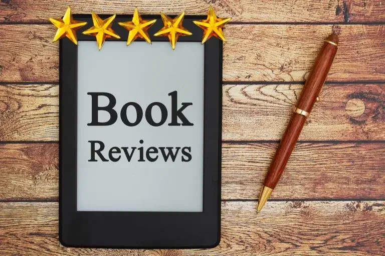 book reviews service, stars on a tablet title book reviews. Book,Reviews,Message,,An,E-reader,On,A,Old,Desk,With